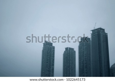 Toronto condo buildings against overcast winter sky