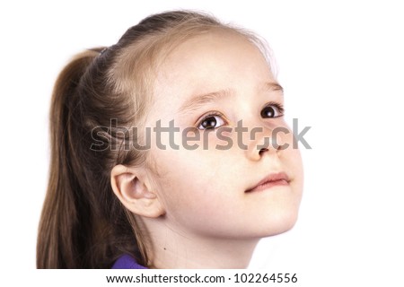 Portrait of little beautiful girl, looking up, isolated on white background, close up