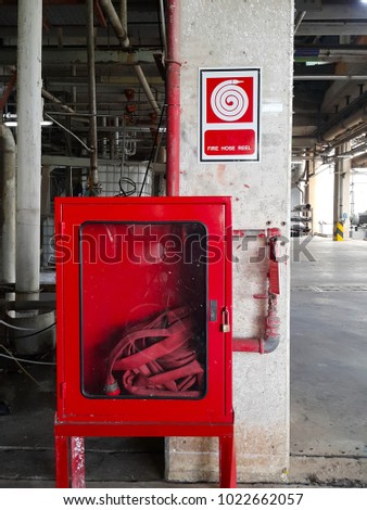 fire hose reel sign on white isolated background and hose reel in box