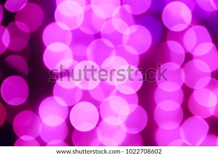 Texture from the blurred purple circles in bokeh style for design. Defocused lights of the city.