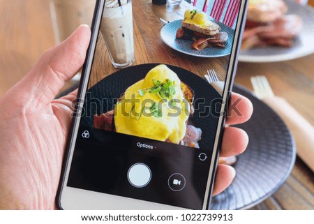 Taking picture of breakfast and drink with smartphone