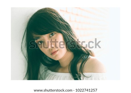 Fashion Portrait of Cute Asian Woman, Film tone with Photo frame.