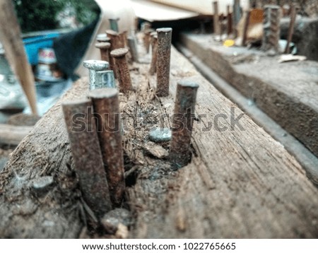 old rusty nails on timber