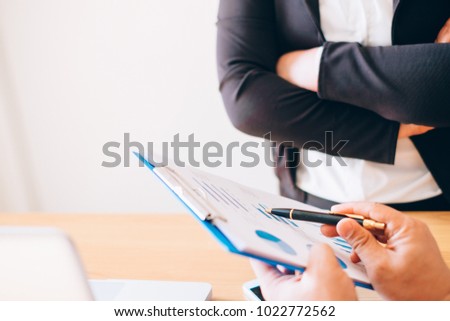Two businessman investment consultant analyzing company financial report balance sheet statement working with documents graphs. Concept picture for stock market, office, tax,and project.

