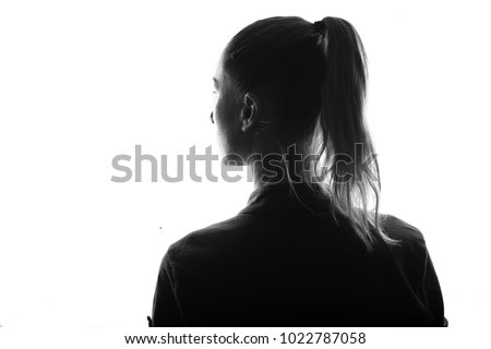 Female person silhouette,view from behind,back lit over white