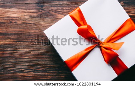 White gift box on table, 8 march, valentine day, birthday or new year concept