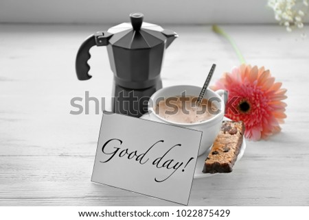 Composition with tasty breakfast and "Good day" wish on wooden table