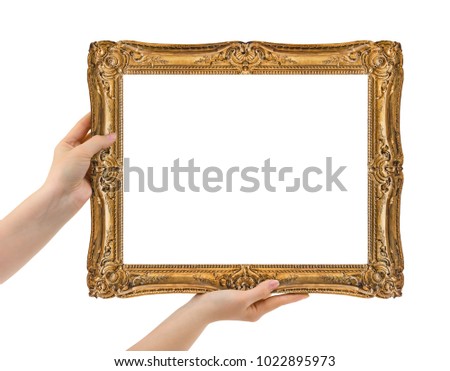 Wooden picture frame in hands isolated on white background