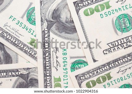 Background of 100 dollar bills on a table