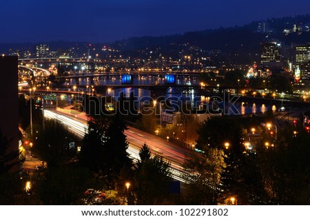 Downtown area of Portland Oregon at night showing its Bridgetown nickname