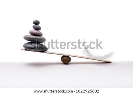 Stone balance with plume. Concept of heavy and light.
 Royalty-Free Stock Photo #1022925802