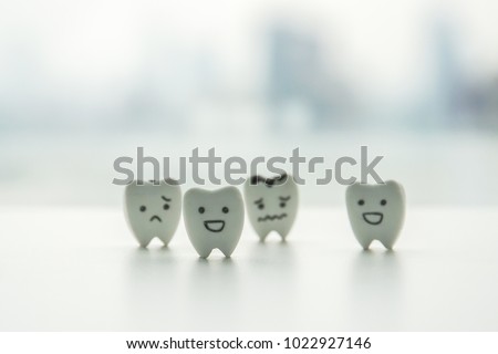 oral health icon - isolated healthy teeth and decayed teeth cartoon with smiley and sad face
