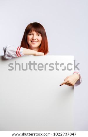 Picture of cook girl in white robe with empty poster