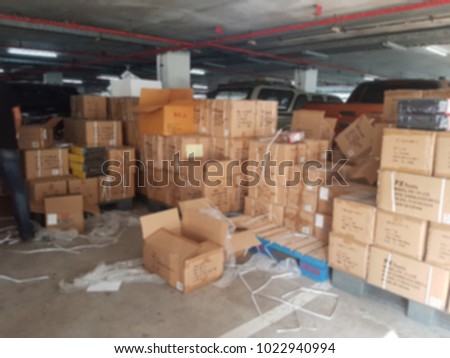 A lot of boxes that contain products inside by waiting for selling. it's blurred picture.