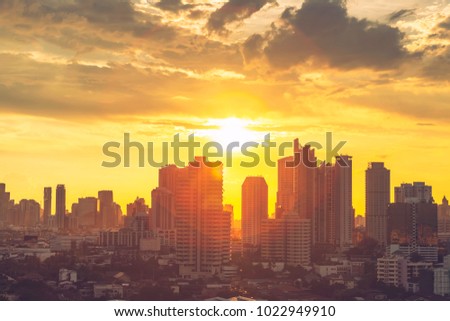 Environment and pollution concept. High modern building in Bangkok downtown and business city center with sun ray at sunset. Picture for add text message. Backdrop for design art work.