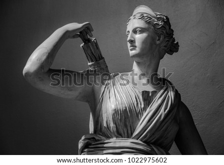 Classic white marble statuette Diana of Versailles Royalty-Free Stock Photo #1022975602