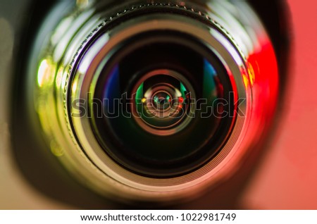 Camera lens and beautiful backlight yellow-red. Optics
