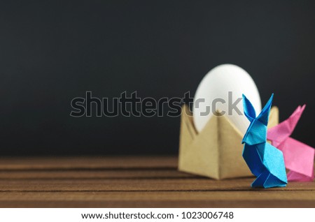 Easter eggs and colorful Easter bunnies, origami, accessories for cards and congratulations with Easter.