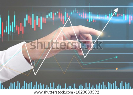 Investment concept,hand with stock financial chart symbols coming from hand