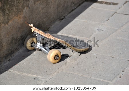broken skate in the street