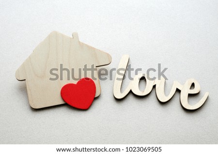 wooden house with red heart and love