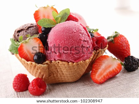 ice cream and berry fruit Royalty-Free Stock Photo #102308947