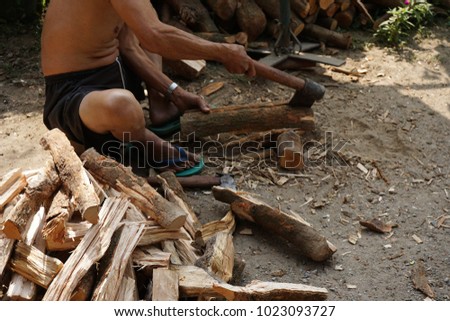 Firewood is prepared for use in the winter. Royalty-Free Stock Photo #1023093727