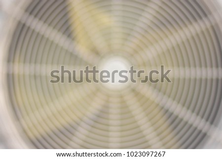 The rotation of the fan blade is rotating rapidly. This creates a blurry background image.
