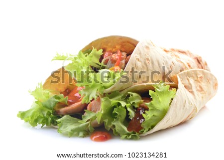 Mexican burrito with chicken and vegetables on a white backgroun