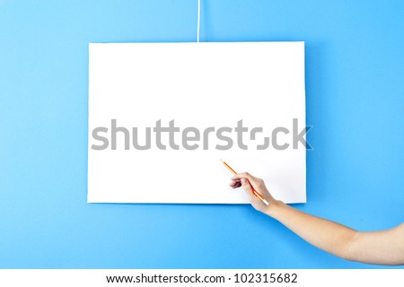 woman hand with pencil on blank space