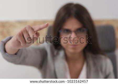 Angry business woman boss pointing out in office. Dismissal concept