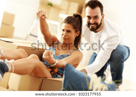 Picture showing happy adult couple moving out or in to new home