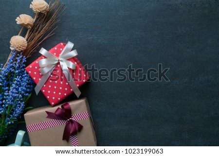 Gift box and gift shopping on black background view from above with copy space