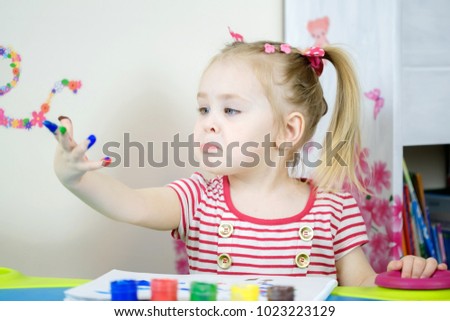 Little cute girl is dissapointed and sad that fingers are dirty