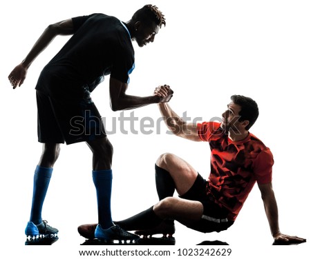 two soccer players men in studio silhouette isolated on white background Royalty-Free Stock Photo #1023242629