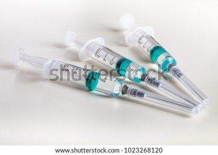 Several syringe on white table prepared for injection in hospital Royalty-Free Stock Photo #1023268120