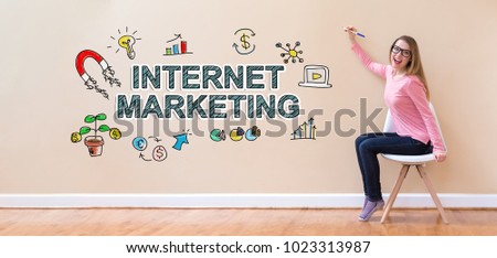 Internet Marketing with young woman holding a pen in a chair