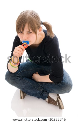 The young amusing girl with a dummy isolated on a white background