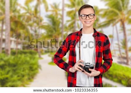 Young man with a vintage camera