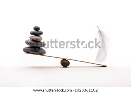 Stone balance with plume. Concept of heavy and light.
 Royalty-Free Stock Photo #1023361102