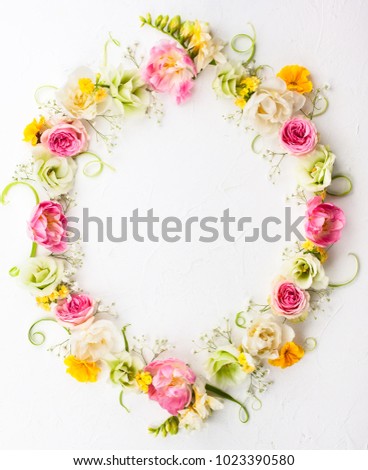 Festive flower composition on the white  background with copy space. Overhead view.