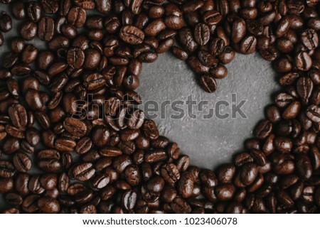 roasted coffee beans, can be used as a background. The concept of Valentine's day. Heart of coffee beans