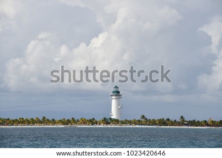 lighthouse on a small caribbean island on a stormy morning