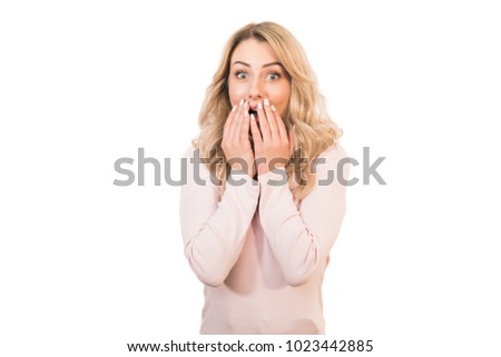 The excited woman standing on the white background