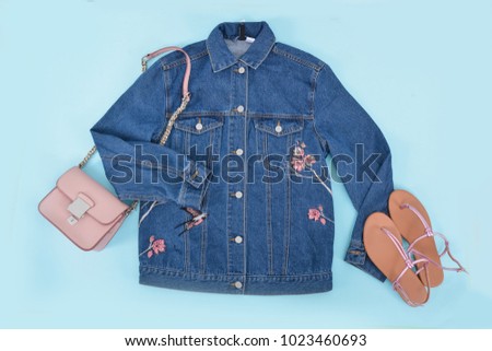 blue Embroidered flowers,bird,bird jacket jeans ,shoes , handbag - 
blue background

