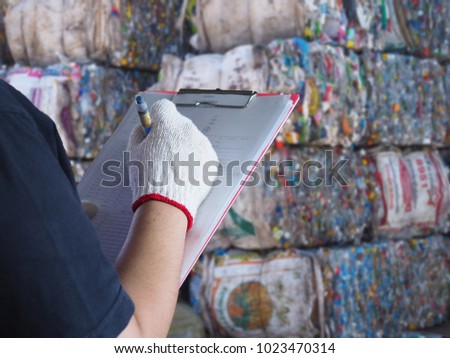 Women work in recycling garbage plant Royalty-Free Stock Photo #1023470314