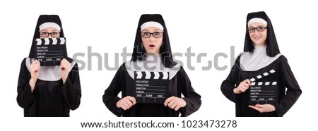 Nun with movie board isolated on white
