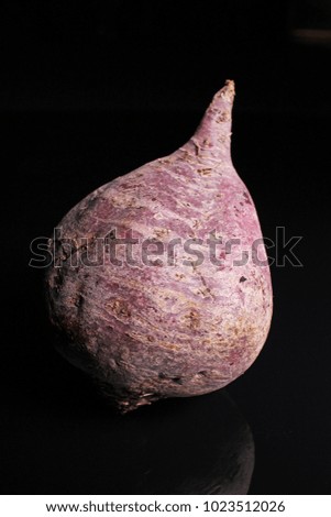 Beetroot beet on black reflective studio background. Isolated black shiny mirror mirrored background for every concept...