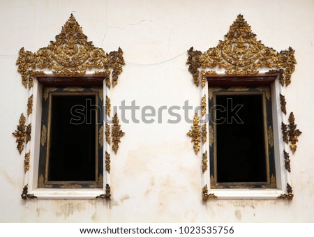 Beautiful old windows of buddism temple in Thailand. 