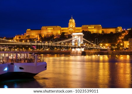 Chain Bridge (Lanchid) and Royal palace at night in Budapest, Hungary Royalty-Free Stock Photo #1023539011